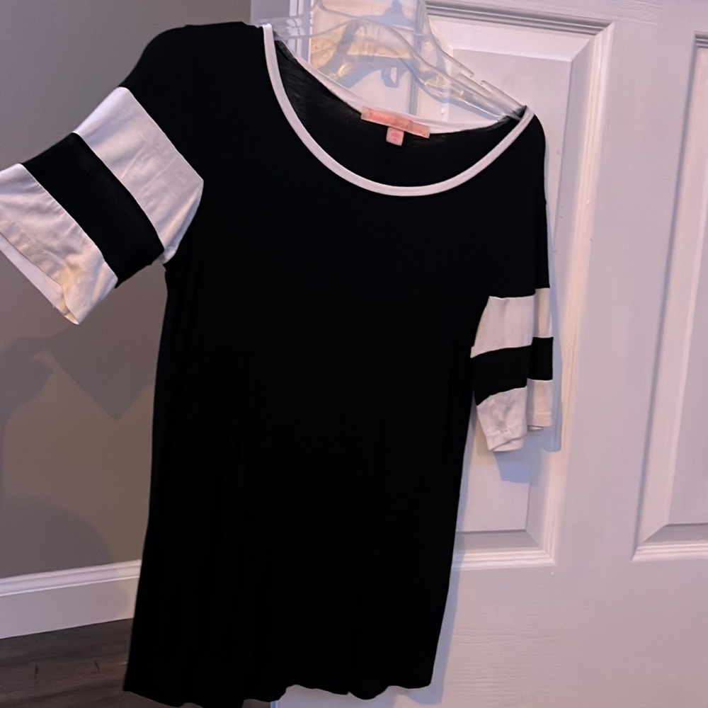 Black and white shirt. Short sleeved with white and black stripes.  Worn twice.